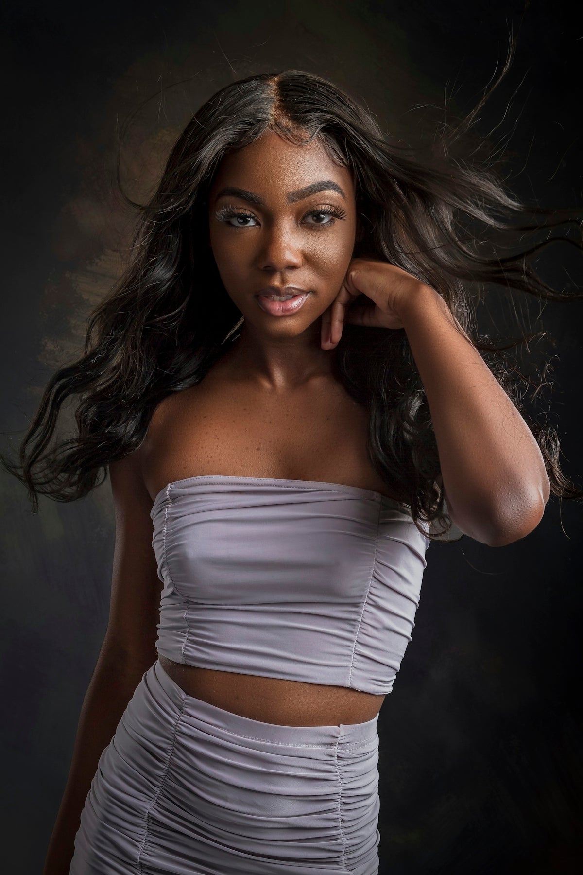 a woman with long hair posing for a picture