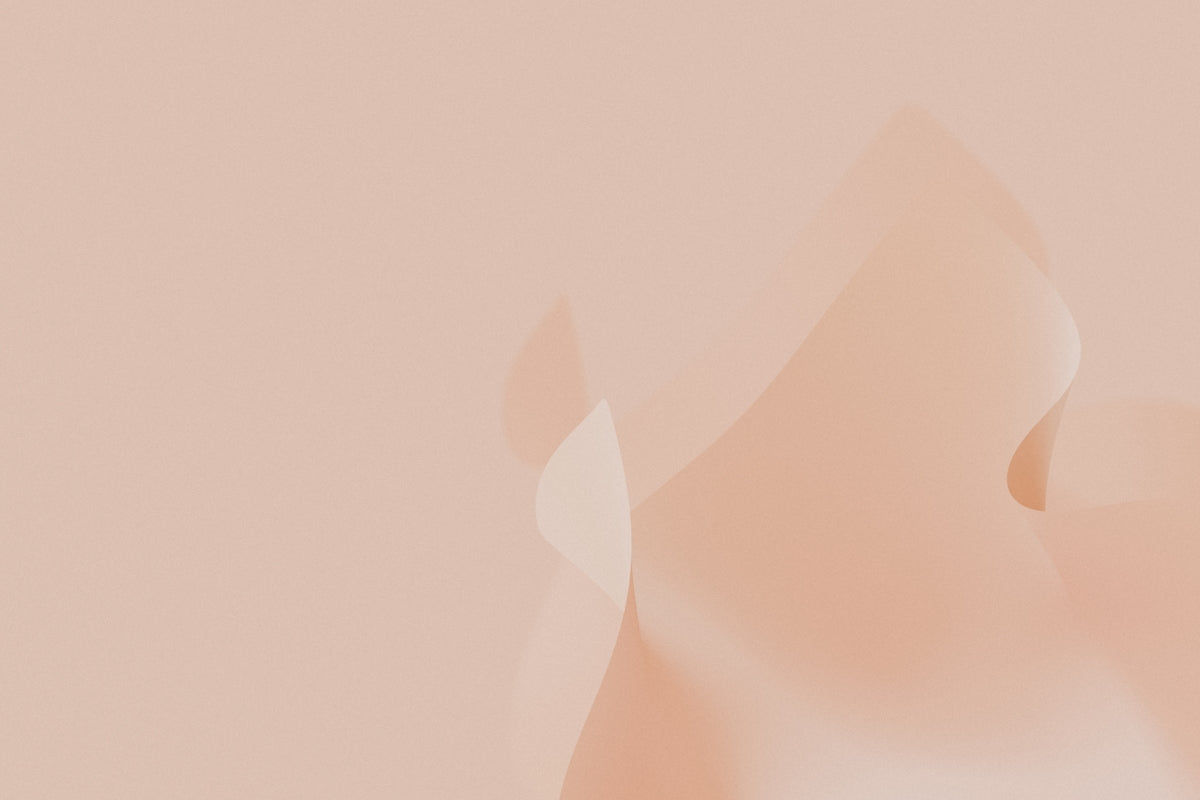 a pink background with a blurry pattern