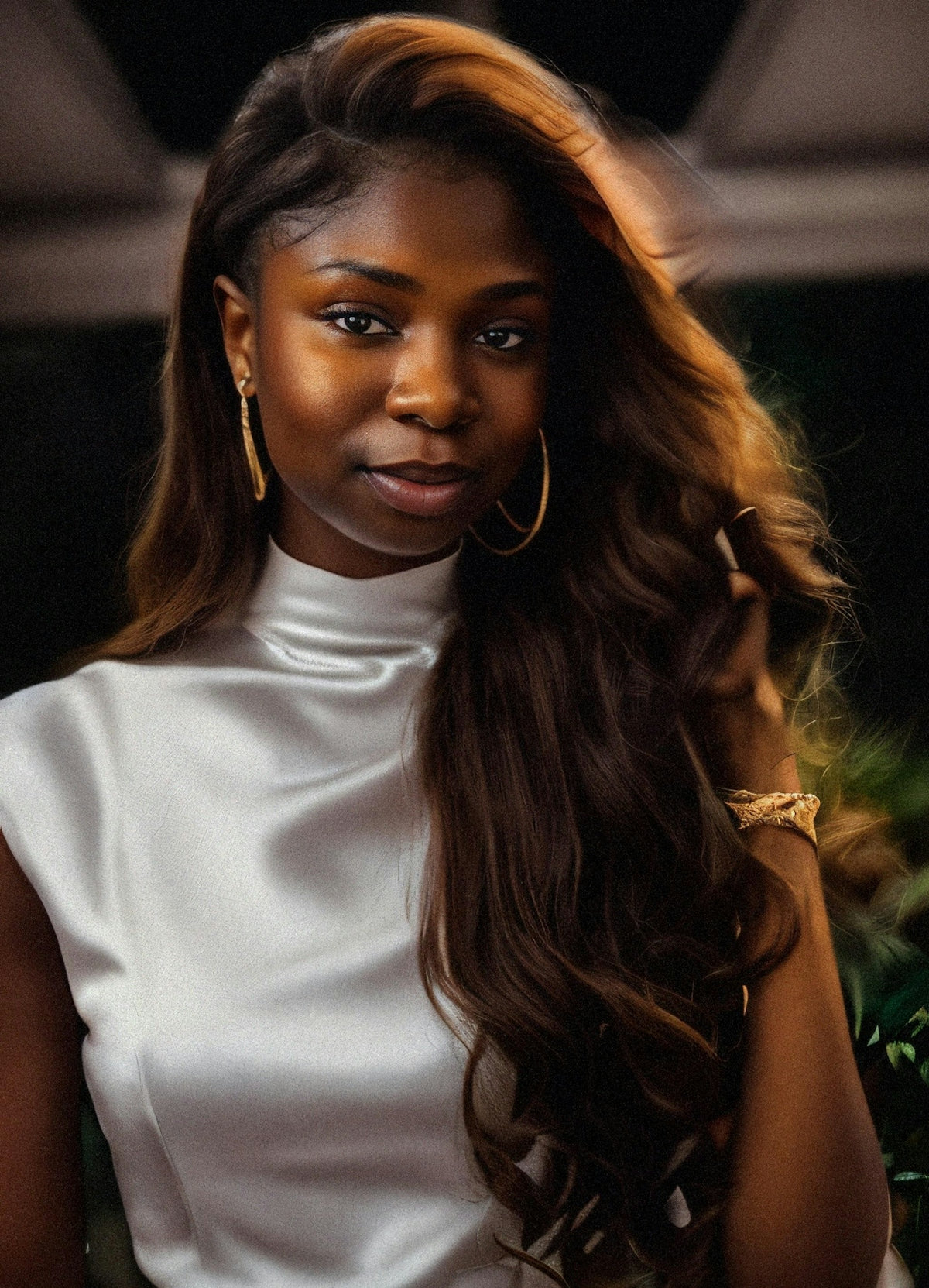 a woman with long hair wearing a white dress